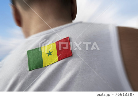 The national flag of Senegal on the athlete's back The national flag of Senegal on the athlete's back 76613287