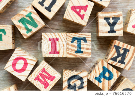 Alphabet letter block in word IT (Abbreviation of information technology) with another on wood background 76616570