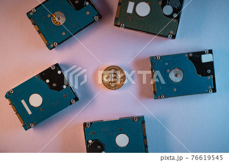 top view of bitcoin cryptocurrency coin with hard disk drive hdd, flat lay 76619545