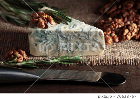 Blue cheese with walnuts and rosemary. Blue cheese with walnuts and rosemary. 76623767