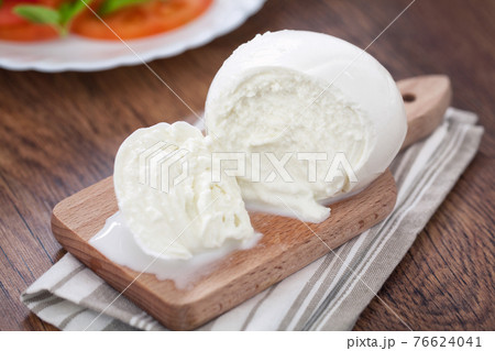 Buffalo Mozzarella, Italian cheese on wooden board. 76624041