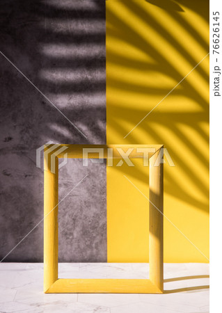 Abstract shadows on a gray-yellow background for the sale of a cosmetic product, a cosmetic showcase in a minimalist style. Trending colors 2121 76626145