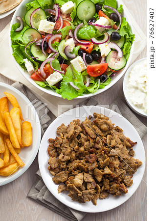 Greek Salad with Gyros and Fries. High quality photo. 76627407