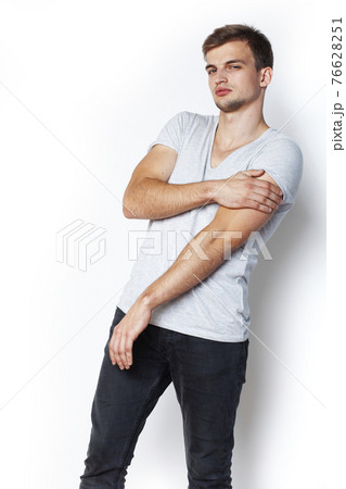young handsome teenage hipster guy posing emotional, happy smiling against white background isolated, lifestyle people concept 76628251