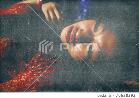 young pretty asian girl in bright colored interior on carpet 76628292