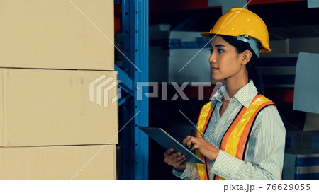 Female warehouse worker working at the storehouse 76629055