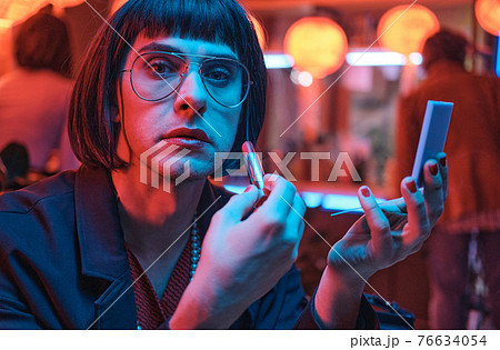 Transsexual painting his lips Transsexual painting his lips 76634054