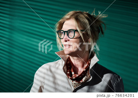 Mature elegant businesswoman at office 76634201