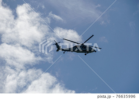 Sheriff Helicopter Hovering on a Beautiful Sky Background Sheriff Helicopter Hovering on a Beautiful Sky Background 76635996