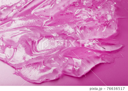 Transparent liquid gel on a pink background with free space. Transparent liquid gel on a pink background with free space. 76636517