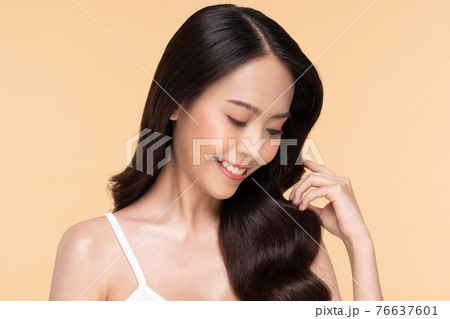Beautiful Asian woman looking at camera smile with clean and fresh skin Happiness and cheerful with positive emotional,isolated on Beige background,Beauty Cosmetics and spa Facial treatment Concept 76637601