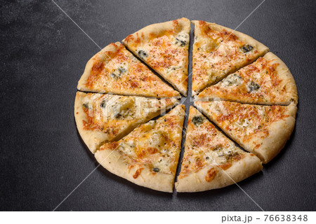 Tasty fresh oven pizza with tomatoes, cheese and mushrooms on a dark concrete background Tasty fresh oven pizza with tomatoes, cheese and mushrooms on a dark concrete background 76638348
