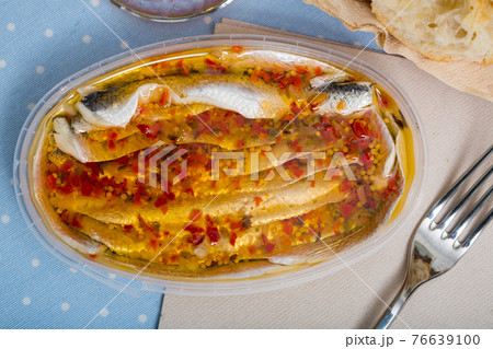 Marinated herring fillet in a plastic jar Marinated herring fillet in a plastic jar 76639100