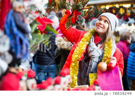 Girl shopping Christmas decorations Girl shopping Christmas decorations 76639249