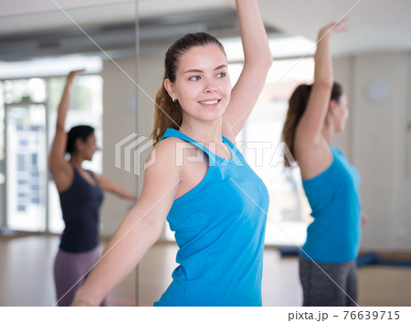 Young adult athletic woman dancing 76639715