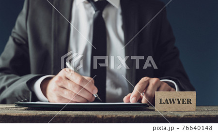 Lawyer signing legal document Lawyer signing legal document 76640148