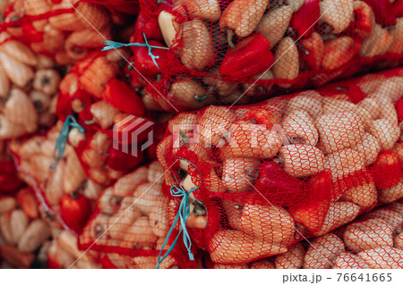 Fresh organic healthy vegetables at grocery store. Vegetables in mesh bags on market 76641665