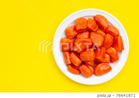 Ripe red Jackfruit on yellow background. Ripe red Jackfruit on yellow background. 76641871
