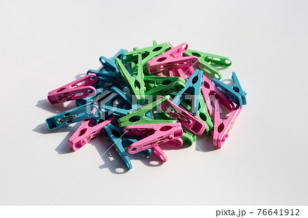 Plastic clothespin on white background. Plastic clothespin on white background. 76641912