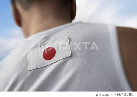 The national flag of Japan on the athlete's back The national flag of Japan on the athlete's back 76643680