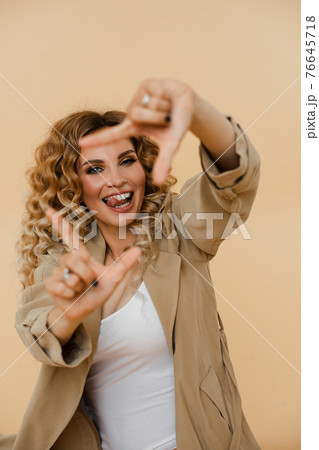Sexy Caucasian girl with wavy hair posing on the Sexy Caucasian girl with wavy hair posing on the 76645718