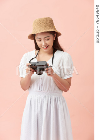 Young pretty hipster cheerful girl posing, having fun alone, travel concept Young pretty hipster cheerful girl posing, having fun alone, travel concept 76649640