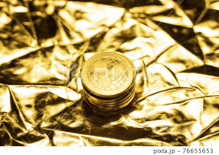 Gold Ripple coins on a golden background. Trading on the cryptocurrency exchange. Cryptocurrency Stock Market Concept. Virtual money concept. Mining or blockchain technology. Business concept. 76655653