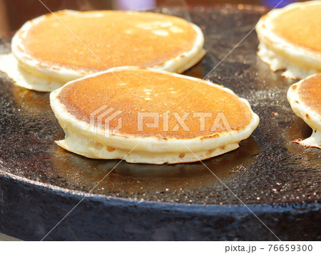 Street food hot pancakes fried on the surface Street food hot pancakes fried on the surface 76659300