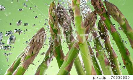 asparagus in water with splashes asparagus in water with splashes 76659639