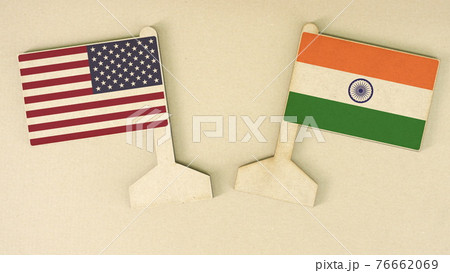 Flags of the USA and India made of cardboard on the desk, flat layout Flags of the USA and India made of cardboard on the desk, flat layout 76662069