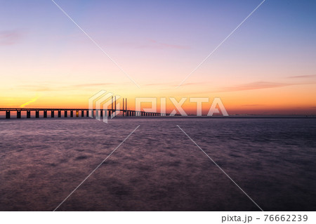 Long exposure sunset at the Oresund bridge Limhamn viewpoint Long exposure sunset at the Oresund bridge Limhamn viewpoint 76662239