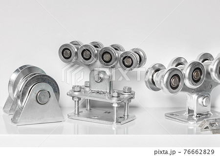 Heavy duty steel roller mechanisms for moving heavy loads. Image on a light background. 76662829
