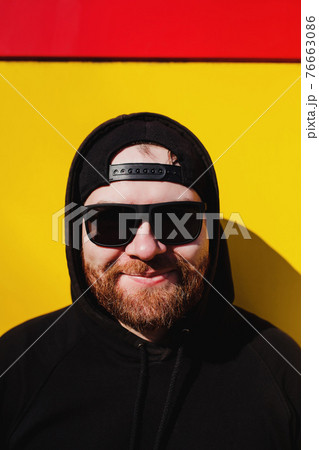 funny man in a cap and sunglasses 76663086