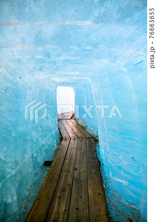 Ice cave inside the Rhone Glacier at Furka Pass in Switzerland Ice cave inside the Rhone Glacier at Furka Pass in Switzerland 76663655