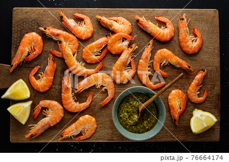 Shrimps with spices on board Shrimps with spices on board 76664174