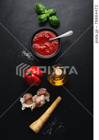 Italian food background with tomato sauce 76664472