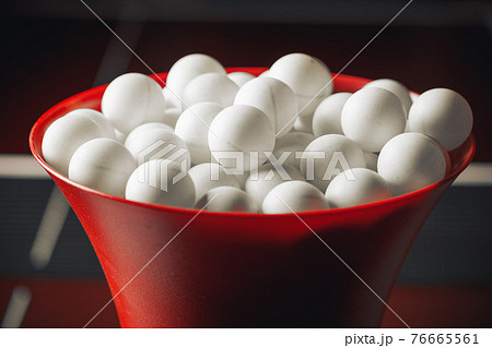 table tennis balls in the robot trainer 76665561