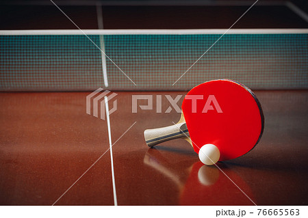 table tennis racket and ball, net background table tennis racket and ball, net background 76665563