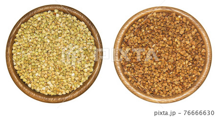 Two buckwheat in wooden cups Two buckwheat in wooden cups 76666630