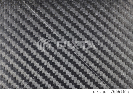 Black carbon kevlar fiber background. 76669617
