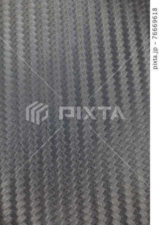 Black carbon kevlar fiber background. 76669618