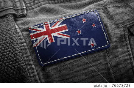 Tag on dark clothing in the form of the flag of the New Zealand 76678723
