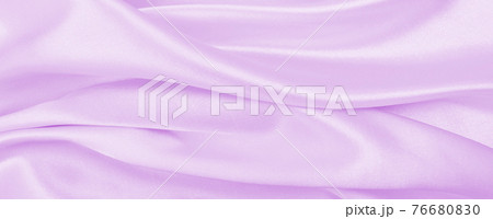 Smooth elegant lilac silk or satin texture as wedding background. Luxurious background design Smooth elegant lilac silk or satin texture as wedding background. Luxurious background design 76680830