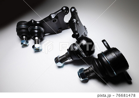 front suspension ball joint new on gray background. Spare parts kit for SUV front suspension ball joint new on gray background. Spare parts kit for SUV 76681478