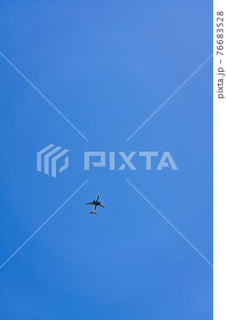 High flying passenger plane against the blue sky High flying passenger plane against the blue sky 76683528