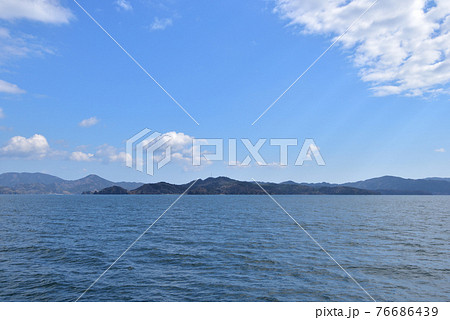 沖から見た石巻市牡鹿半島 狐崎漁港方面の写真素材