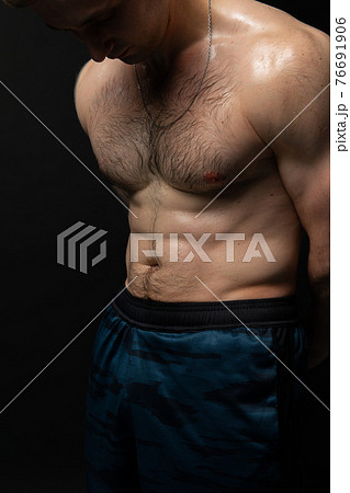 Man on black background keeps dumbbells pumped up in fitness active chest torso, training strong lifting powerful, shirtless pectoral. Lift skin power, guy fit beautiful press with hair Man on black background keeps dumbbells pumped up in fitness active chest torso, training strong lifting powerful, shirtless pectoral. Lift skin power, guy fit beautiful press with hair 76691906