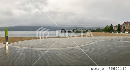 Panoramic view of the beach in Kelowna on overcast rainy day Panoramic view of the beach in Kelowna on overcast rainy day 76692112