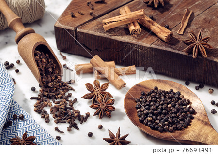Set of spices on marble table 76693491