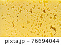 The texture of cut, milk cheese. 76694044